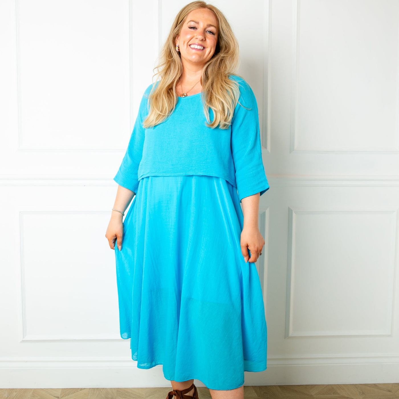The aqua blue Two Piece Dress with a top that has 3/4 length sleeves and a round neckline