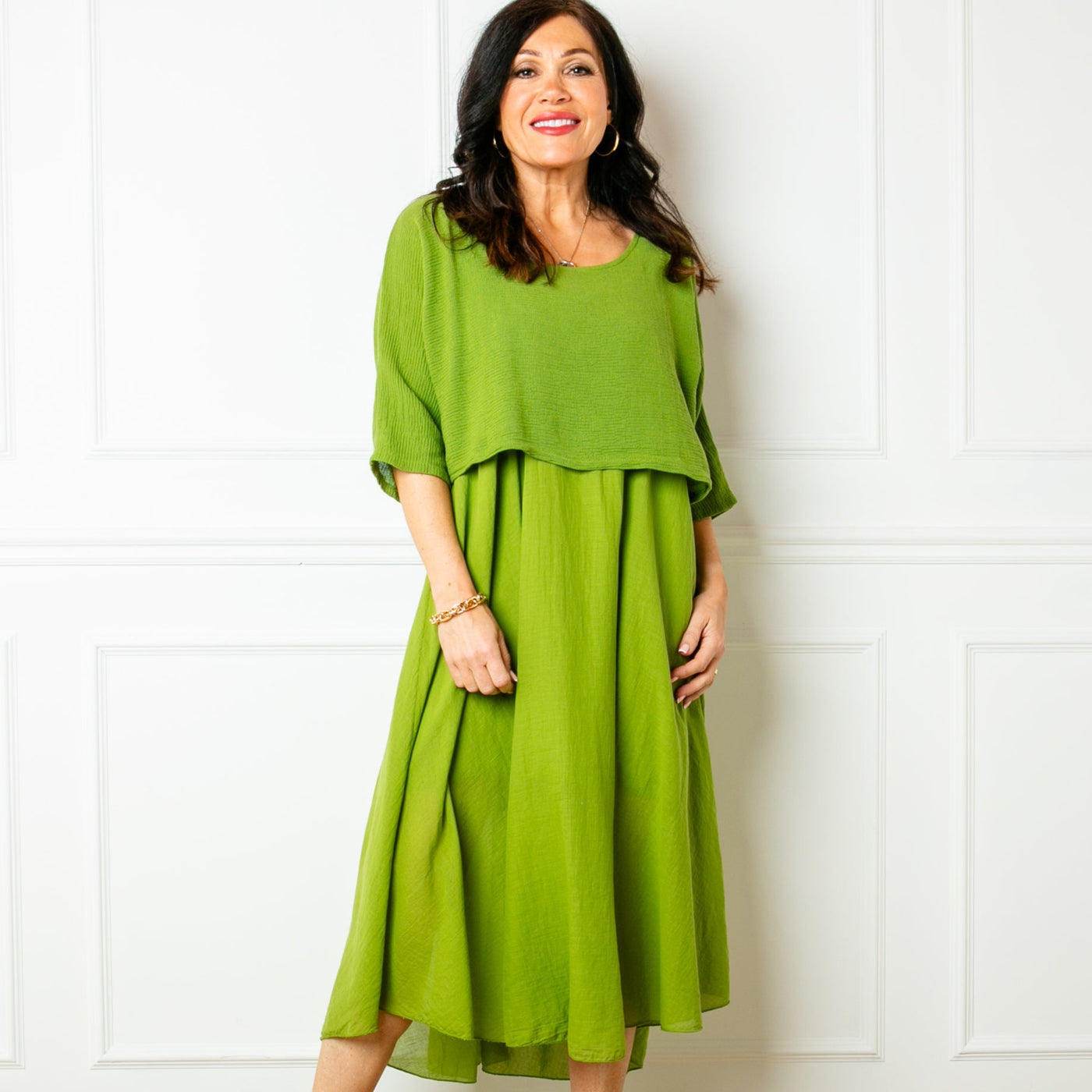 The green Two Piece Dress with a top that has 3/4 length sleeves and a round neckline
