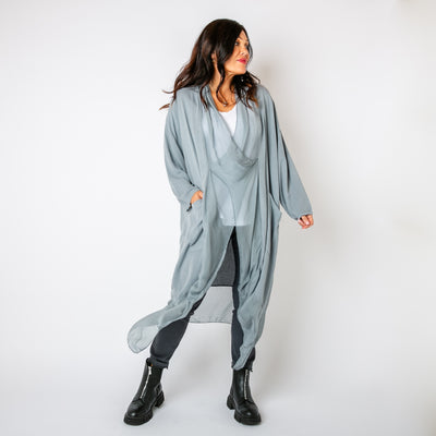 The grey Two Pocket Crossover Tunic with an asymmetric silk hemline