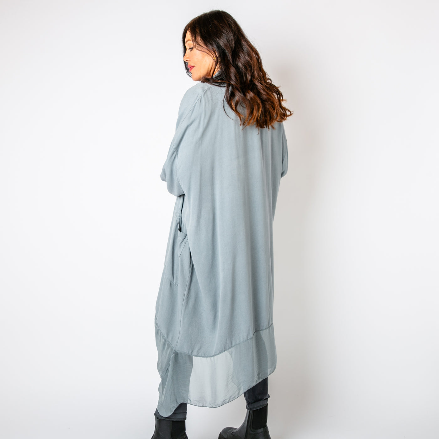 The grey Two Pocket Crossover Tunic with a draped low hanging cowl neckline 