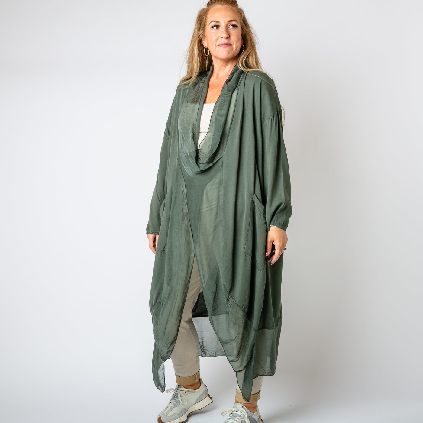 The khaki green Two Pocket Crossover Tunic with a draped low hanging cowl neckline 