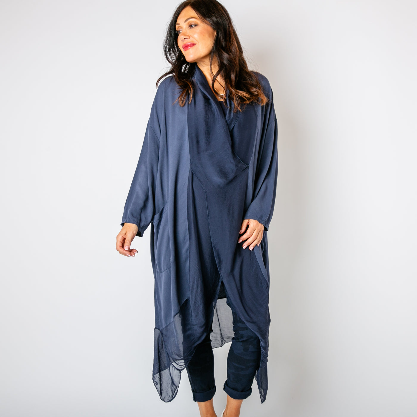 The navy blue Two Pocket Crossover Tunic with long sleeves and a loose fit