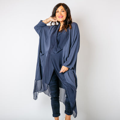 The navy blue Two Pocket Crossover Tunic with a draped low hanging cowl neckline 