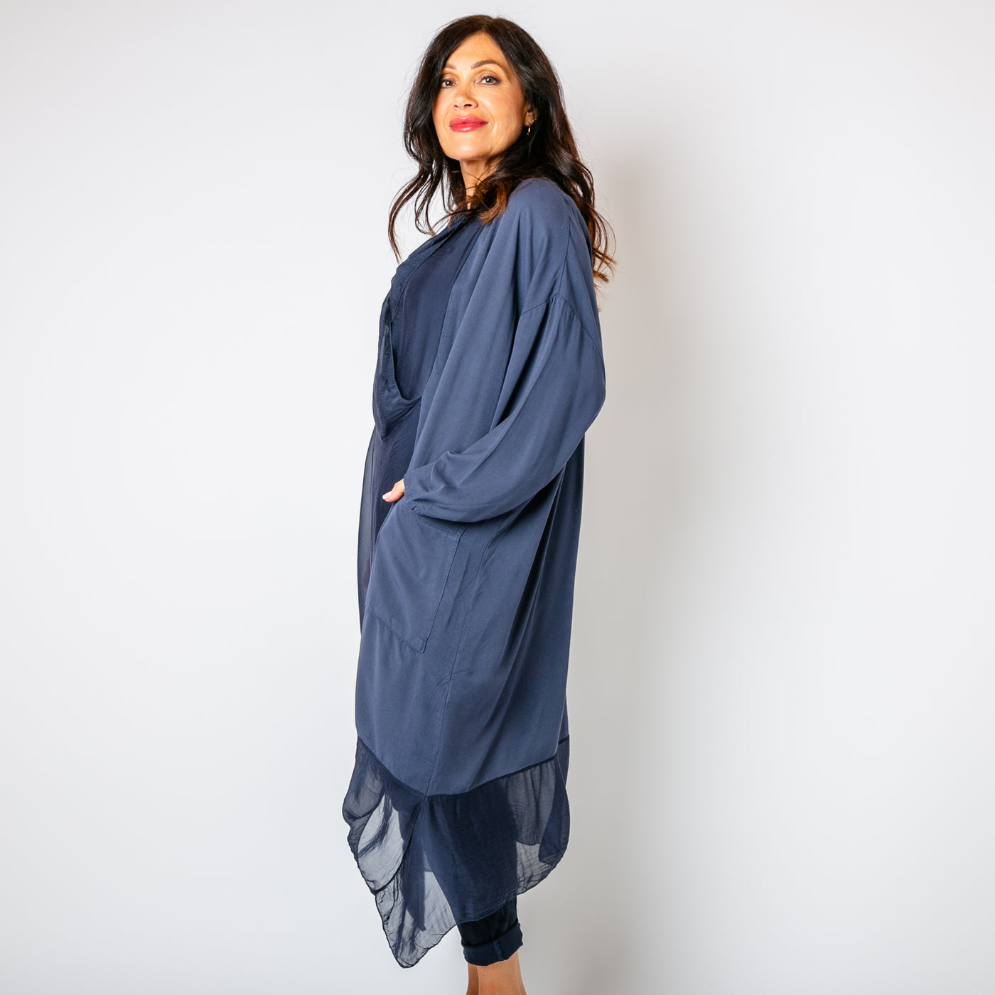 The navy blue Two Pocket Crossover Tunic with an asymmetric silk hemline