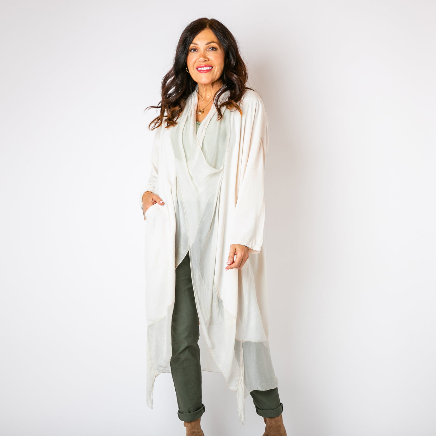 The stone cream Two Pocket Crossover Tunic with long sleeves and a loose fit