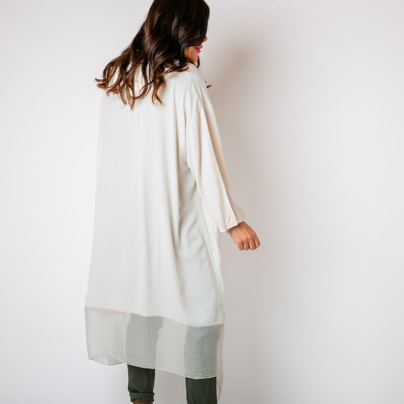 The stone cream Two Pocket Crossover Tunic with an asymmetric silk hemline