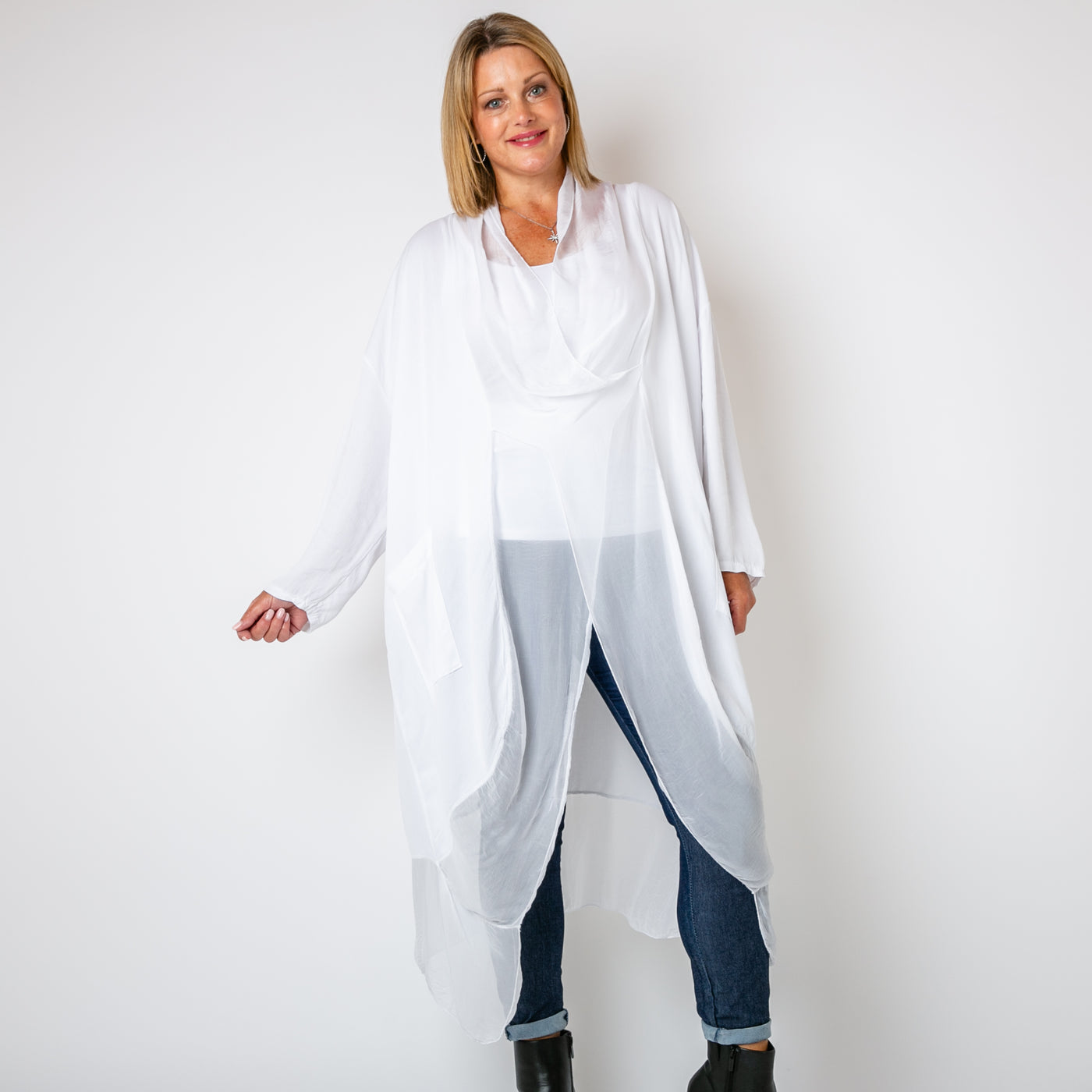 The white Two Pocket Crossover Tunic with an asymmetric silk hemline