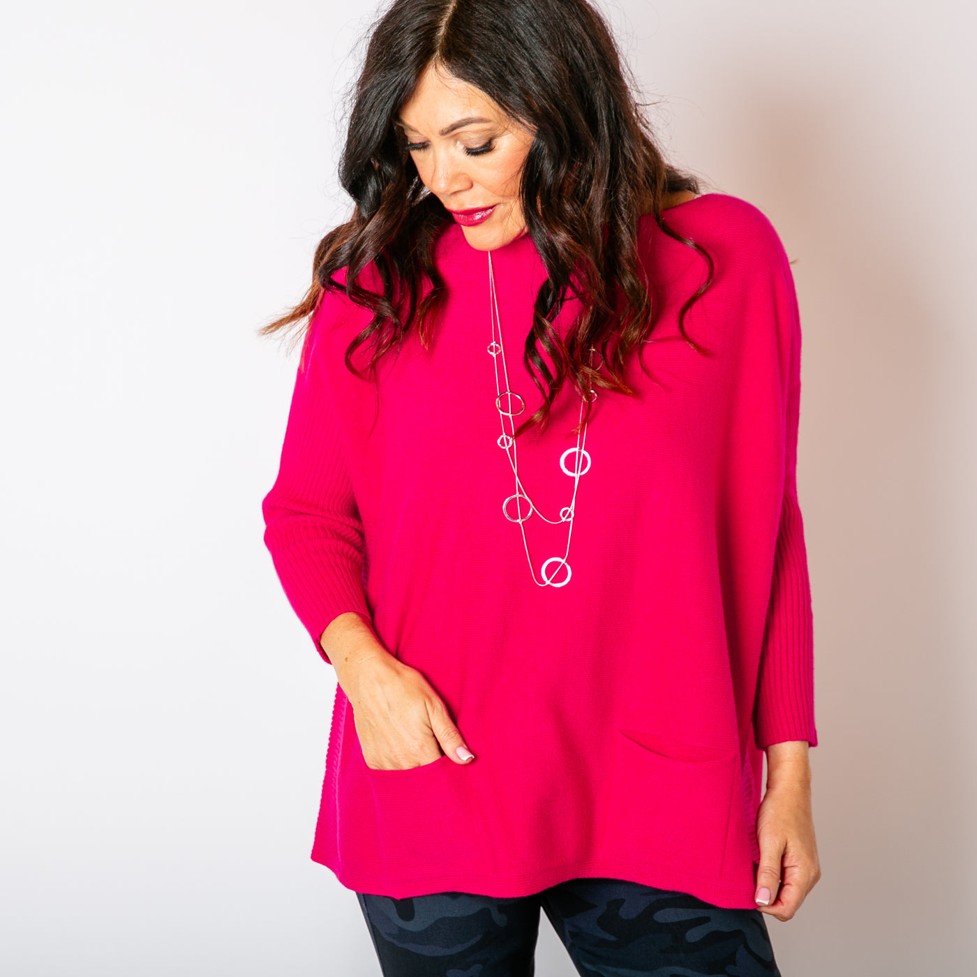 The fuchsia pink Two Pocket Ribbed Sleeve Jumper with a wide round neckline