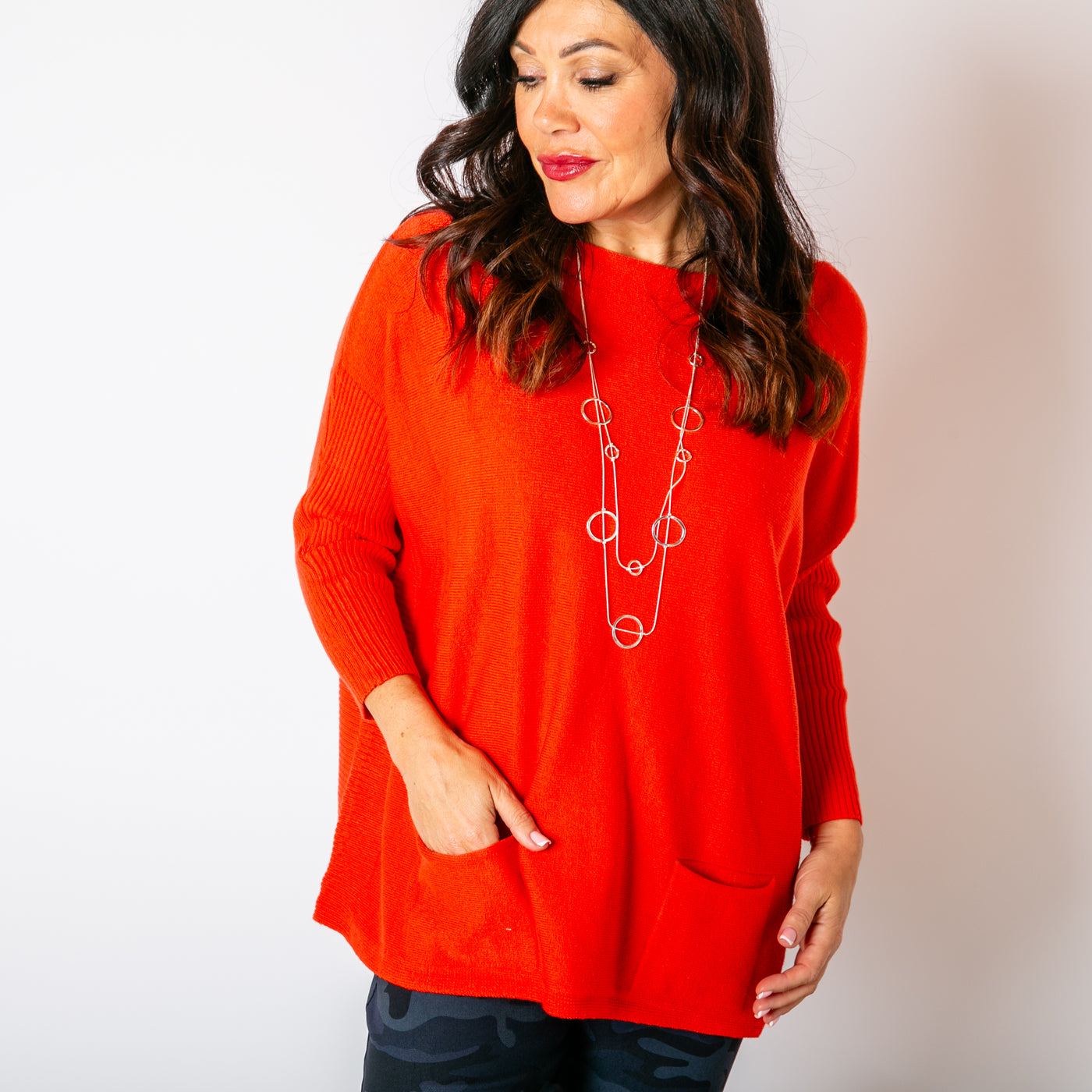 The orange Two Pocket Ribbed Sleeve Jumper with a wide round neckline