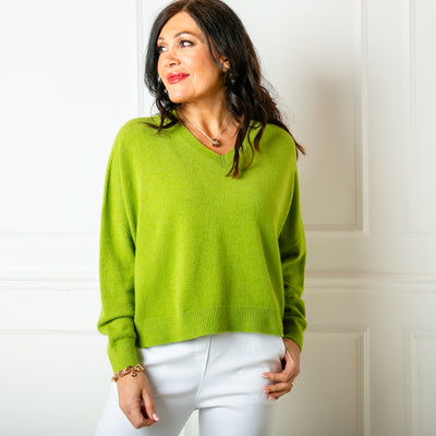 The chartreuse green V Neck Short Jumper with long sleeves for a comfy fit