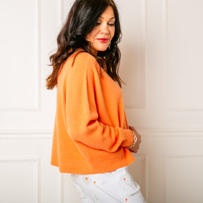 The orange V Neck Short Jumper made from a fine knitted blend perfect for summer evenings
