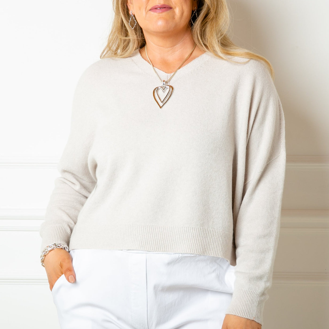 The stone cream V Neck Short Jumper with long sleeves for a comfy fit