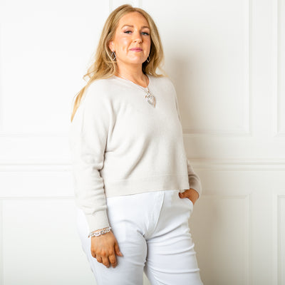 The stone cream V Neck Short Jumper with ribbed detailing around the cuffs, neckline and bottom hem