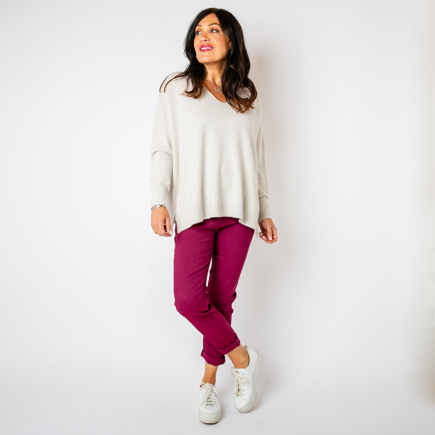 The cream V Neck Split Jumper with long sleeves and a v neckline