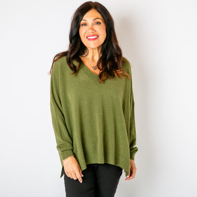 The khaki green V Neck Split Jumper with ribbed detailing around the cuffs, neckline and bottom hemline