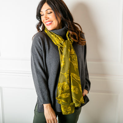 The Vienna Scarf in chartreuse green featuring a beautiful leaf print with metallic details