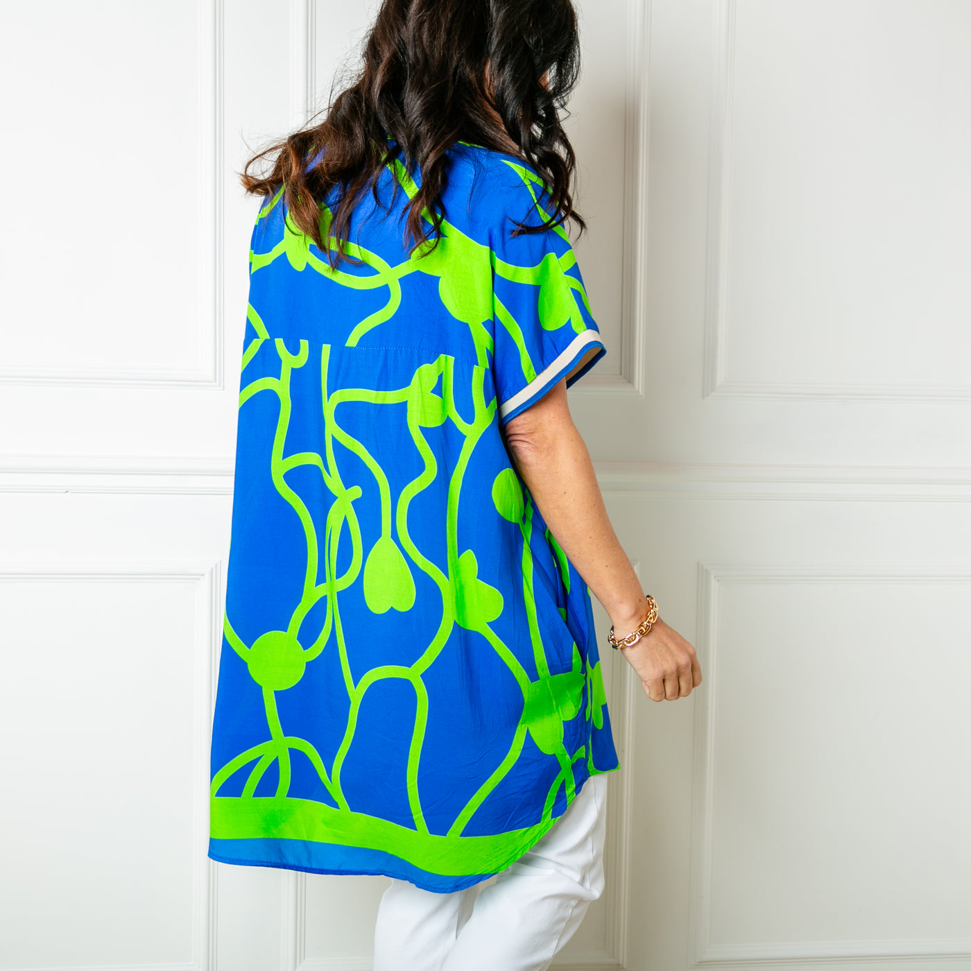The Vine Short Sleeve Tunic in royal blue with a v neckline in a lightweight viscose fabric 