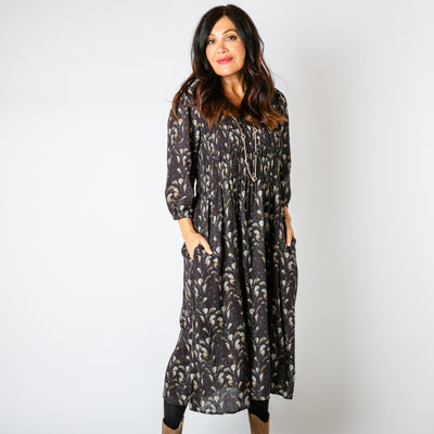 The chocolate brown Watercolour Leaf Shirred Dress featuring a beautiful natural leaf pattern