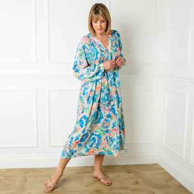 The blue Wild Garden Maxi Dress with buttons down the front and elasticated shirring over the bust for added stretch