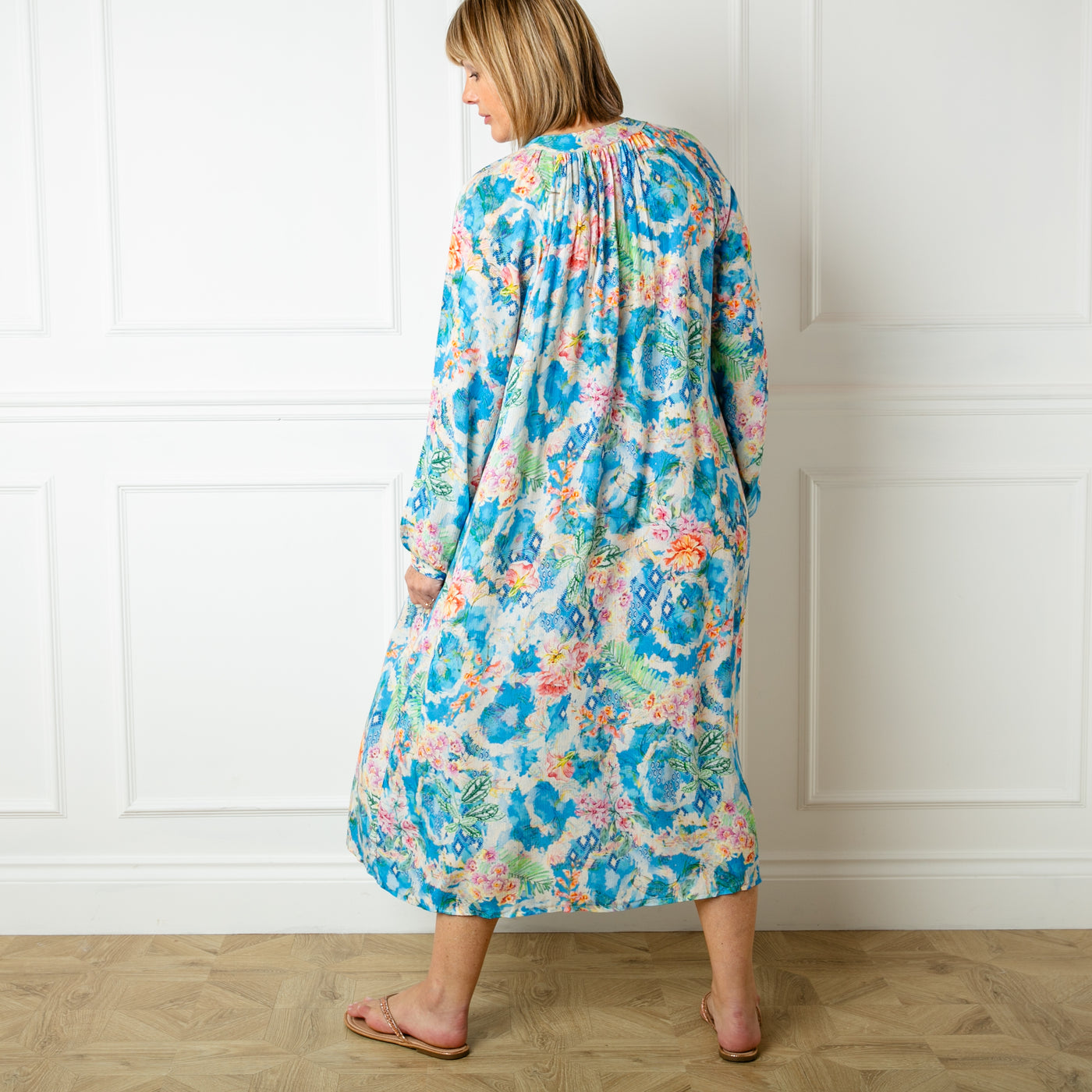 The blue Wild Garden Maxi Dress made from a lightweight viscose material in a beautiful detailed floral print pattern