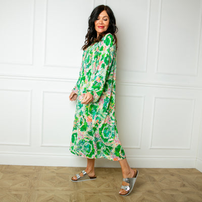 The green Wild Garden Maxi Dress with buttons down the front and elasticated shirring over the bust for added stretch
