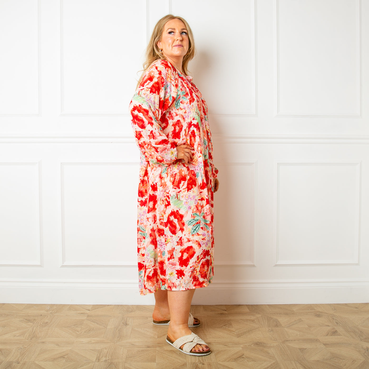 The red Wild Garden Maxi Dress made from a lightweight viscose material in a beautiful detailed floral print pattern