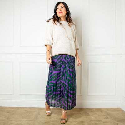 The purple and green Wild Pleated Skirt in a midi length with a stretchy viscose lining underneath