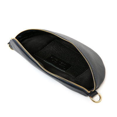 The navy blue Winchester Leather Handbag which is a half moon shape with a zip across the front