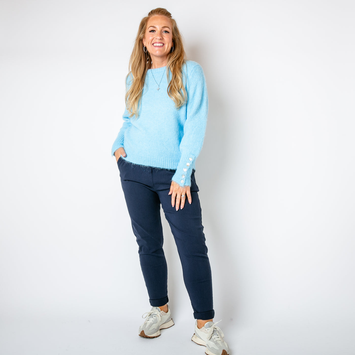 The baby blue Wool Button Jumper with button fastenings on either sleeve