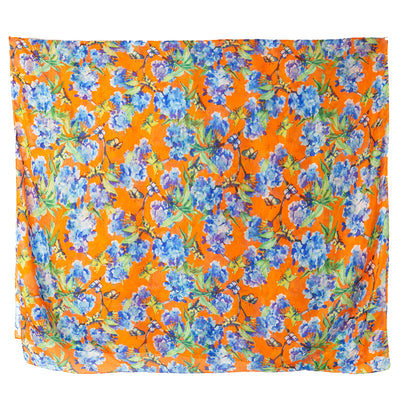 The Forget Me Knot Silk Scarf in orange and blue with hints of green and brown