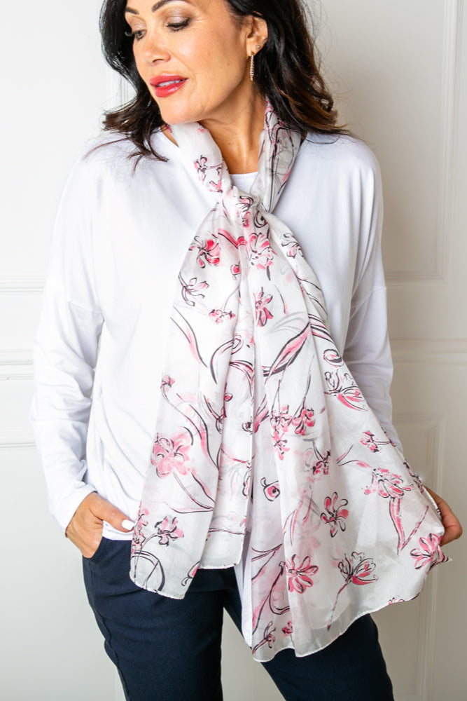 The Pink Cherry Blossom Silk Scarf which is great for adding a feminine touch to an outfit