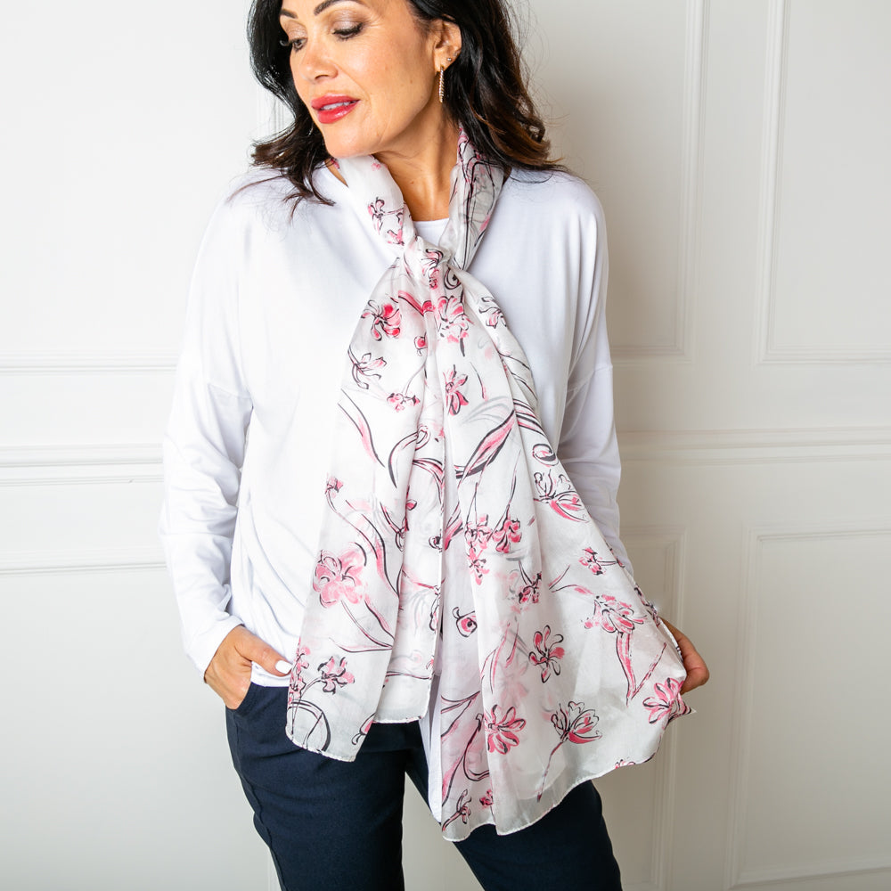 The Pink Cherry Blossom Silk Scarf which is great for adding a feminine touch to an outfit