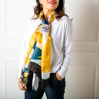 The Abstract Waves Silk Scarf which is great for adding a pop of colour to an outfit