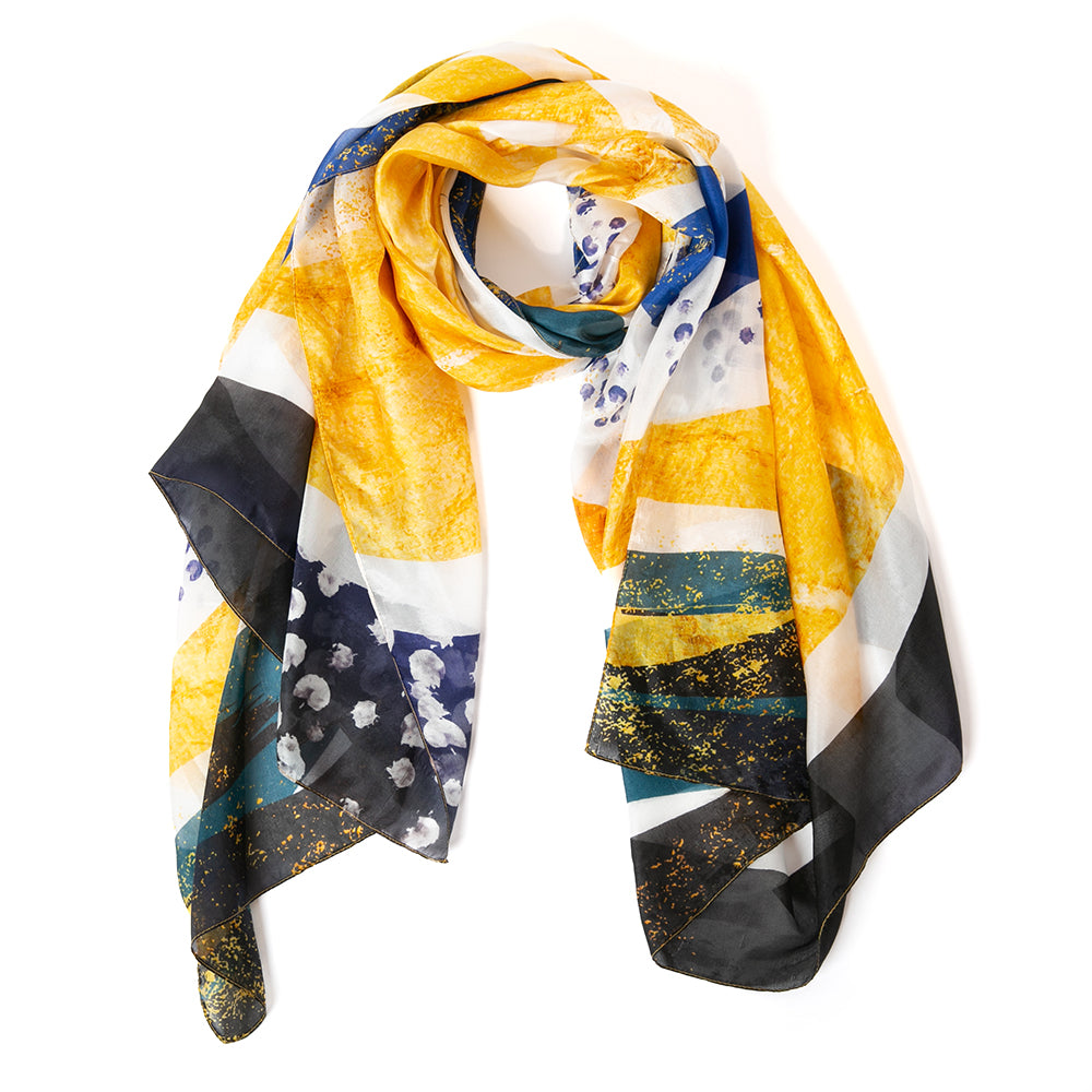 The Abstract Waves Silk Scarf in yellow with accents of blue, white and black