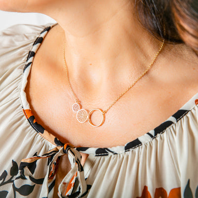 Shown on model the Alora necklace in Gold, beautiful delicate dream catcher necklace