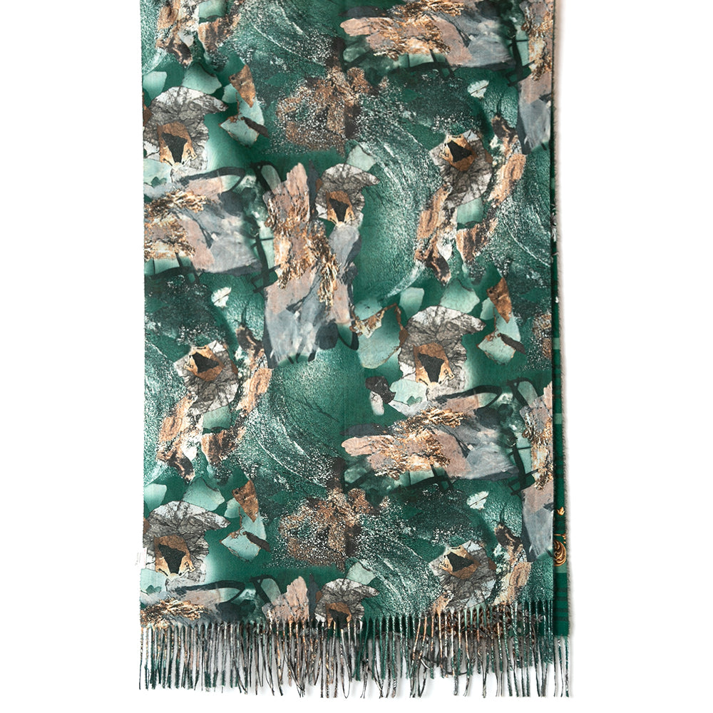 Austin Scarf in dark green featuring the reverse side with an abstract collage pattern