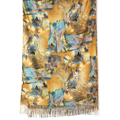 Austin Scarf in yellow featuring the reverse side with an abstract collage pattern