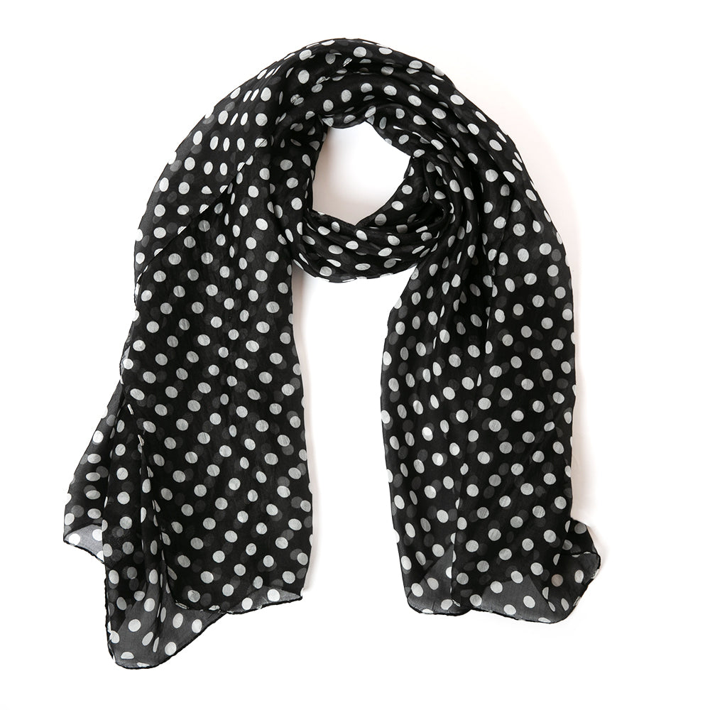 The Black Polka Dot Silk Scarf in black and white featuring a gorgeous classic spotty print pattern