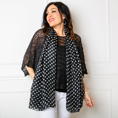 The Black Polka Dot Silk Scarf made from 100% silk making it the perfect luxury accessory or gift