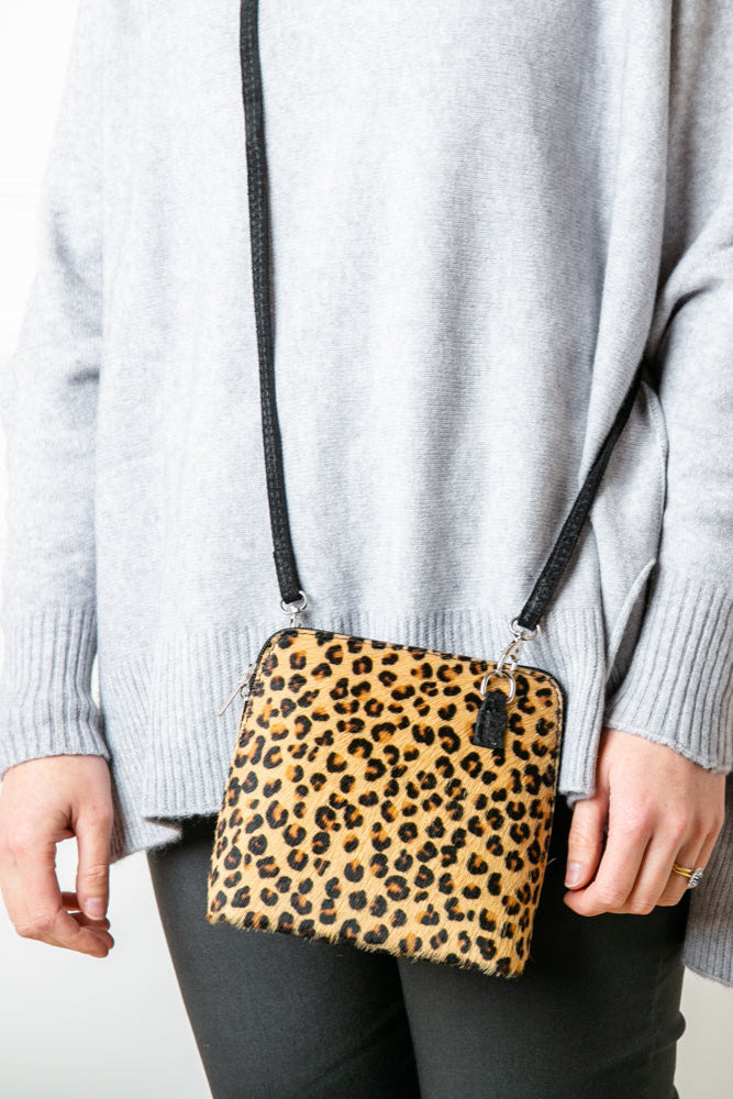 Bronte Animal Print crossbody Jaguar bag 100% italian leather silver hardware side zip detachable strap on a model