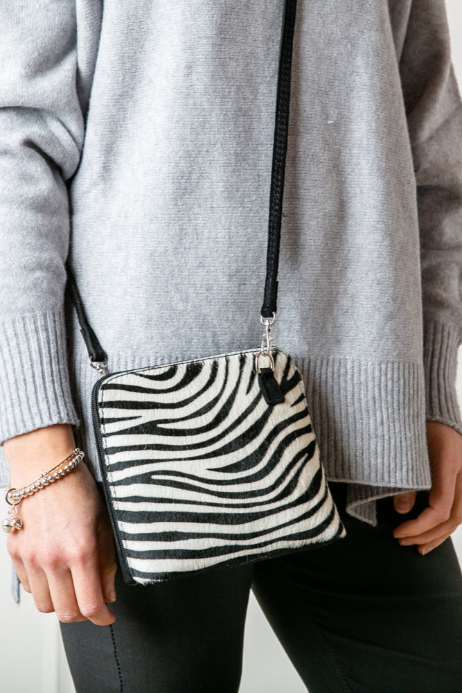 Bronte Animal Print crossbody Zebra bag 100% italian leather silver hardware side zip detachable strap on a model
