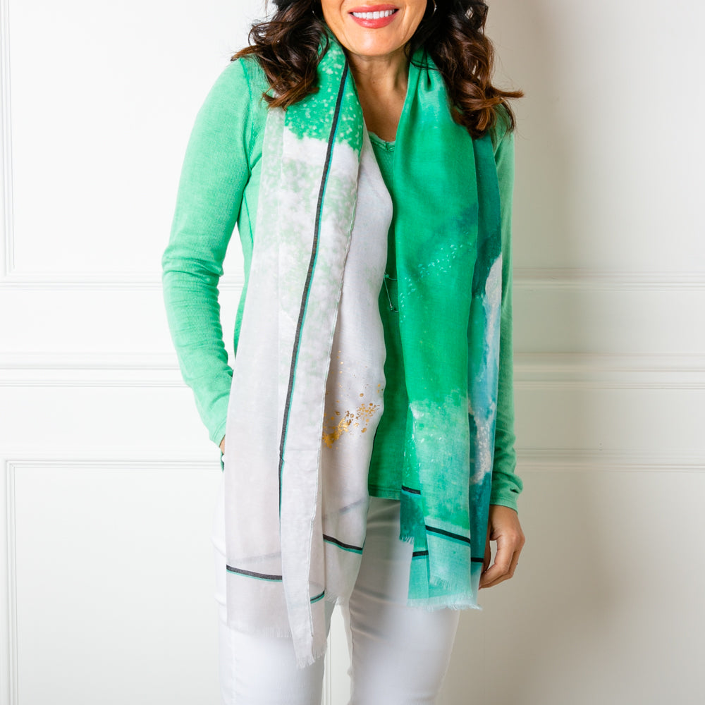 The Cairo scarf in green, made from a lightweight viscose and cotton blend fabric