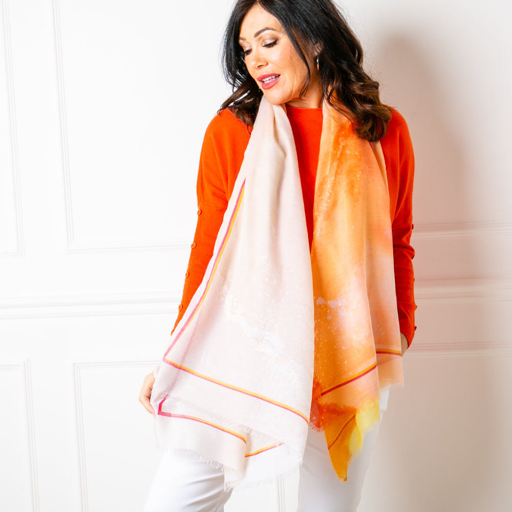 The Cairo scarf in orange, made from a lightweight viscose and cotton blend fabric