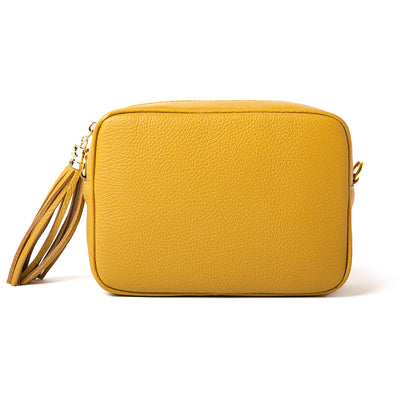 Mustard yellow Chichester leather handbag with long detachable strap, gold hardware and side tassel detail