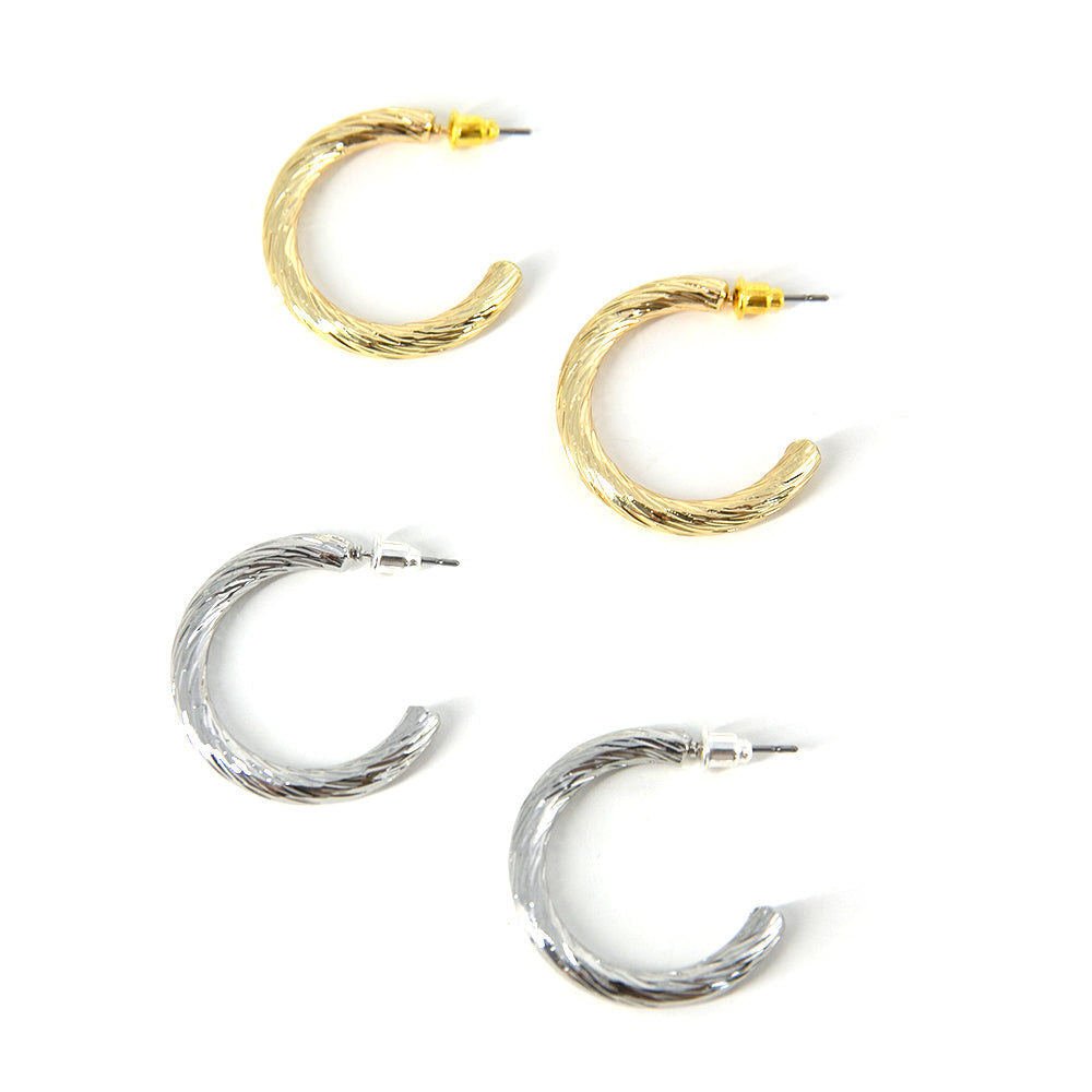 Cordelia Womens classic hoop earrings, lightbox image with both gold and silver hoops, textured design with a shiny finish