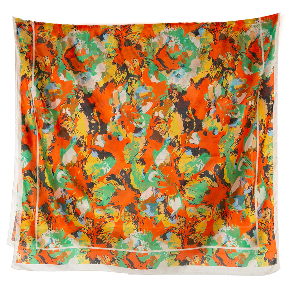 The Flower Paint Brush Silk Scarf featuring an abstract floral painted print in shades of red yellow green and black