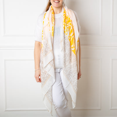 The New York Scarf in yellow featuring a beautiful bohemian style batik paisley print pattern