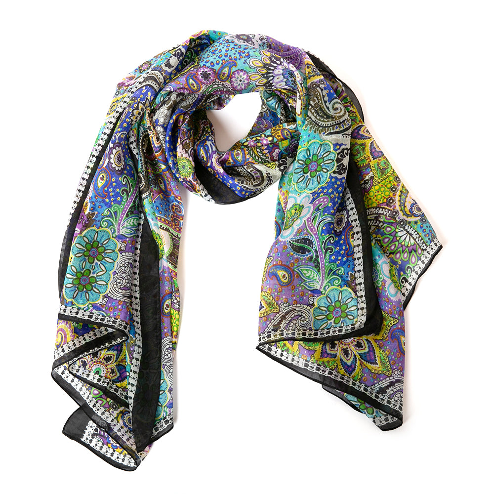 The Paisley Blossom Silk Scarf featuring a beautiful, intricate paisley floral print with a black and white border