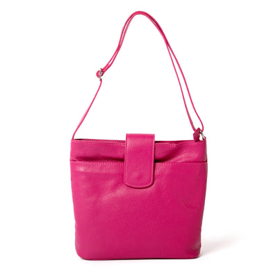 Pimlico Handbag in fuchsia pink, shown from the front and including the adjustable leather strap, the fold over press stud fastening and the outside pocket. Made from Italian leather.