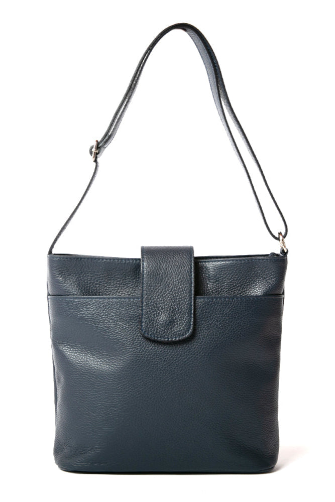 Pimlico Handbag in navy blue, shown from the front and including the adjustable leather strap, the fold over presstud fastening and the outside pocket. Made from Italian leather.
